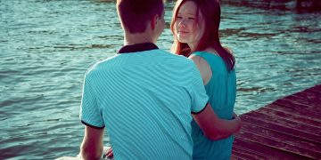 girl and boy, by the pond, by the water, embankment, together