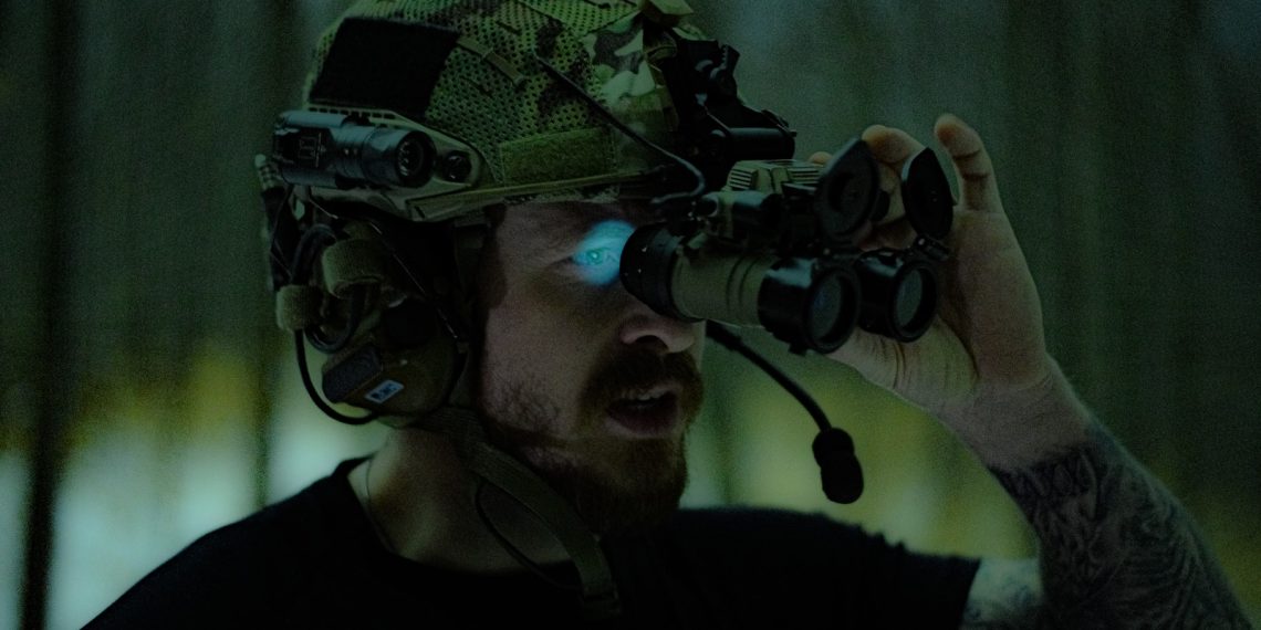 man in black crew neck shirt holding black dslr camera