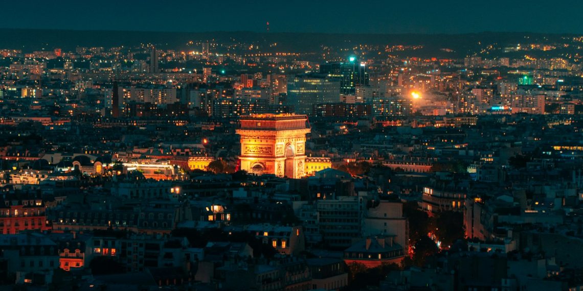 a view of a city at night from the top of a building