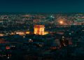 a view of a city at night from the top of a building