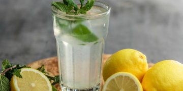 lime juice on drinking glass beside sliced limes